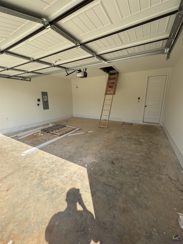 502 Otters Ridge Dr, Kathleen, GA 31047 - garage with electric panel, a garage door opener, and baseboards