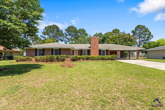 214 Markwood Dr, Warner Robins, GA 31093 - single story home with concrete driveway, a chimney, an attached carport, and a front lawn