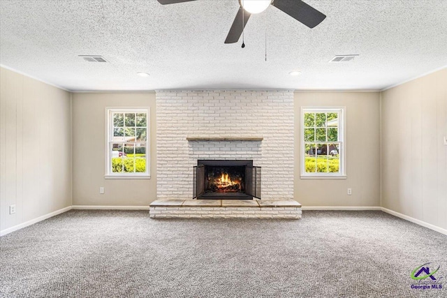 214 Markwood Dr, Warner Robins, GA 31093 - unfurnished living room with a fireplace, carpet, ceiling fan, a textured ceiling, and baseboards