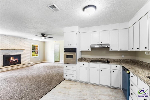 214 Markwood Dr, Warner Robins, GA 31093 - kitchen featuring stainless steel oven, under cabinet range hood, a textured ceiling, dishwashing machine, and a ceiling fan