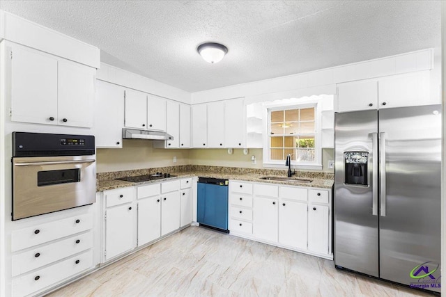 214 Markwood Dr, Warner Robins, GA 31093 - kitchen with appliances with stainless steel finishes, a sink, under cabinet range hood, white cabinets, and a textured ceiling