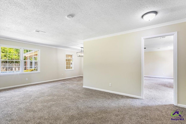 214 Markwood Dr, Warner Robins, GA 31093 - carpeted empty room with a chandelier, ornamental molding, baseboards, and a textured ceiling