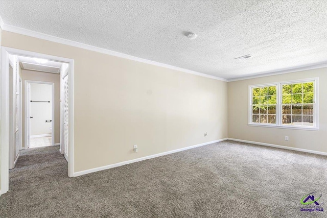 214 Markwood Dr, Warner Robins, GA 31093 - spare room with carpet floors, ornamental molding, baseboards, and a textured ceiling