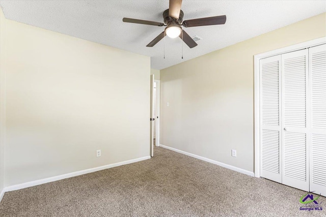 214 Markwood Dr, Warner Robins, GA 31093 - unfurnished bedroom featuring carpet flooring, a closet, baseboards, and ceiling fan