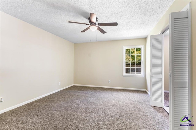 214 Markwood Dr, Warner Robins, GA 31093 - unfurnished bedroom with carpet, a textured ceiling, baseboards, a closet, and ceiling fan