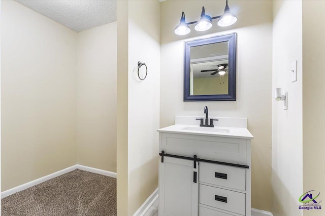 214 Markwood Dr, Warner Robins, GA 31093 - bathroom featuring vanity, baseboards, and a textured ceiling