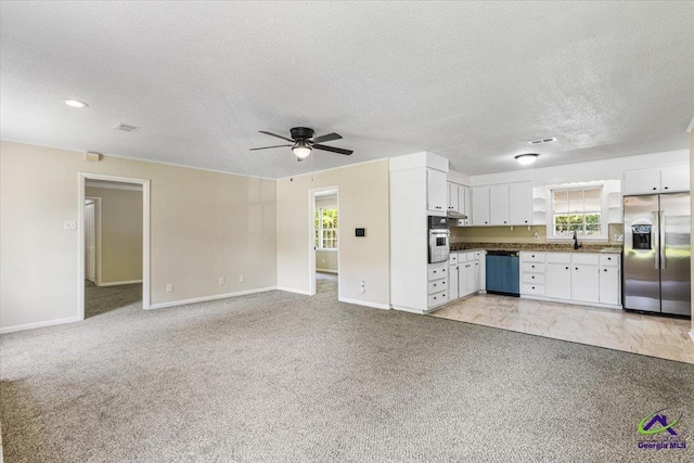 214 Markwood Dr, Warner Robins, GA 31093 - unfurnished living room featuring ceiling fan, light carpet, a sink, baseboards, and a textured ceiling