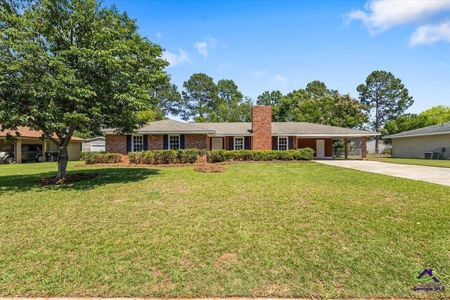 214 Markwood Dr, Warner Robins, GA 31093 - ranch-style home with concrete driveway, a chimney, a front yard, and an attached carport