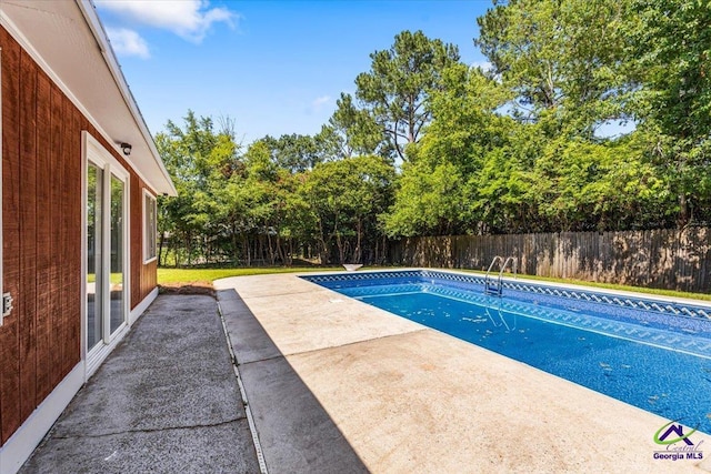 214 Markwood Dr, Warner Robins, GA 31093 - view of pool featuring a fenced backyard, a patio area, and view of wooded area