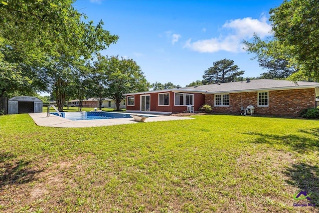 214 Markwood Dr, Warner Robins, GA 31093 - back of house featuring a patio area, an outdoor pool, a lawn, and brick siding