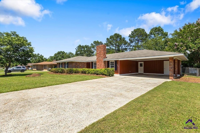 214 Markwood Dr, Warner Robins, GA 31093 - single story home featuring a chimney, concrete driveway, and a carport