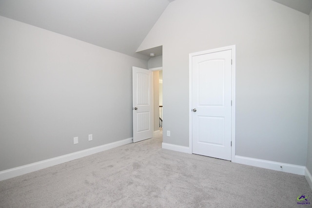 606 Samantha Brooke Way, Bonaire, GA 31005 - unfurnished bedroom with carpet flooring, baseboards, and high vaulted ceiling