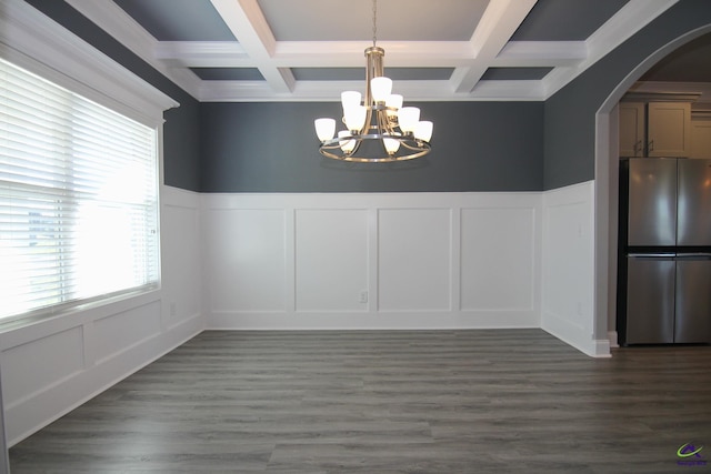 606 Samantha Brooke Way, Bonaire, GA 31005 - unfurnished dining area with a decorative wall, a chandelier, coffered ceiling, arched walkways, and beam ceiling