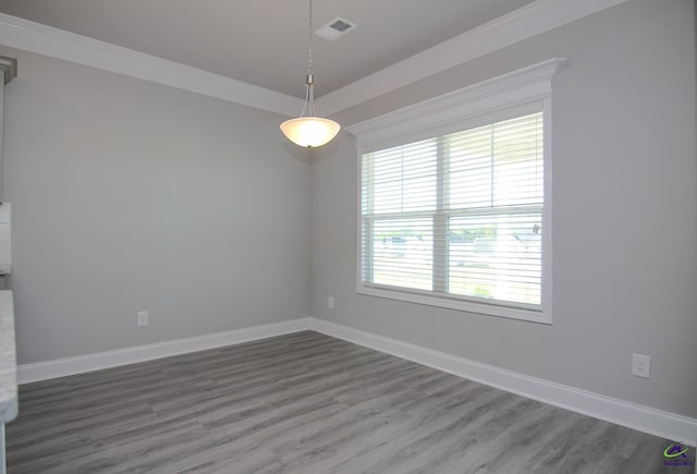 606 Samantha Brooke Way, Bonaire, GA 31005 - spare room with wood finished floors, crown molding, and baseboards