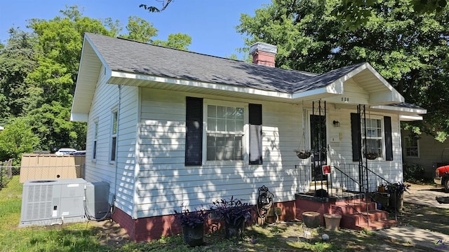 129 Tinker Blvd, Warner Robins, GA 31093 - bungalow featuring central AC unit, a chimney, and a shingled roof