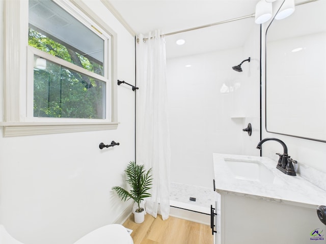 744 Corbin Ave, Macon, GA 31204 - full bathroom with a tile shower, vanity, wood finished floors, and toilet