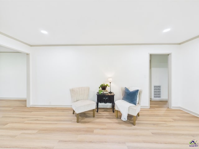 744 Corbin Ave, Macon, GA 31204 - living area featuring light wood-style flooring, crown molding, baseboards, and recessed lighting