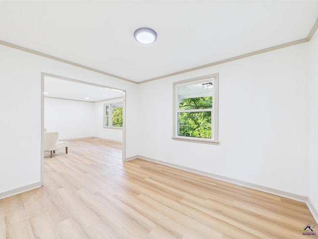 744 Corbin Ave, Macon, GA 31204 - spare room with light wood-type flooring, crown molding, and baseboards