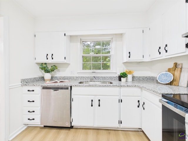 3081 Tiffin Cir, Macon, GA 31204 - kitchen with appliances with stainless steel finishes, a sink, light wood-style floors, white cabinets, and light stone counters