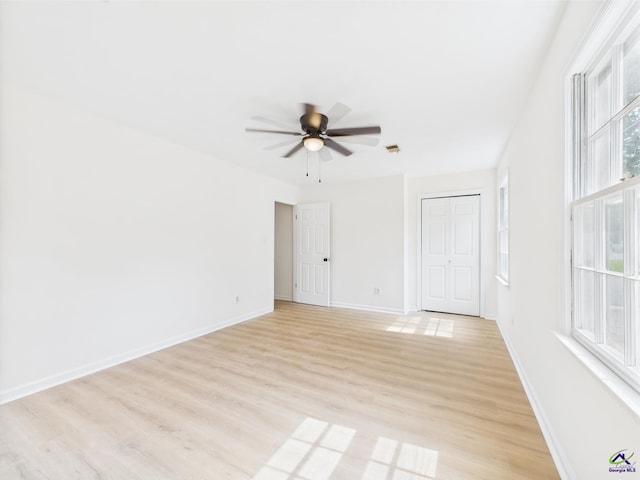 3081 Tiffin Cir, Macon, GA 31204 - unfurnished room with light wood-style floors, a ceiling fan, and baseboards
