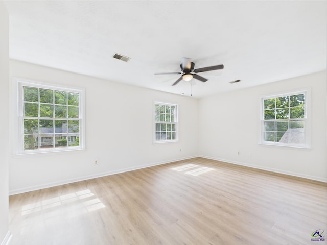 3081 Tiffin Cir, Macon, GA 31204 - empty room featuring light wood-style floors, a ceiling fan, and baseboards