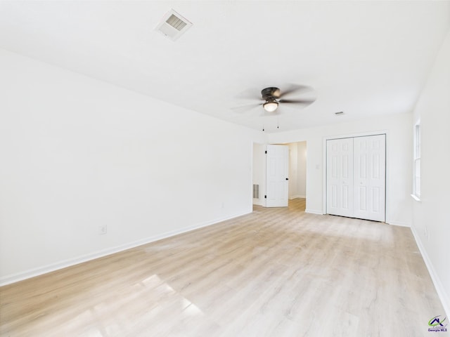 3081 Tiffin Cir, Macon, GA 31204 - empty room with a ceiling fan, light wood-type flooring, and baseboards