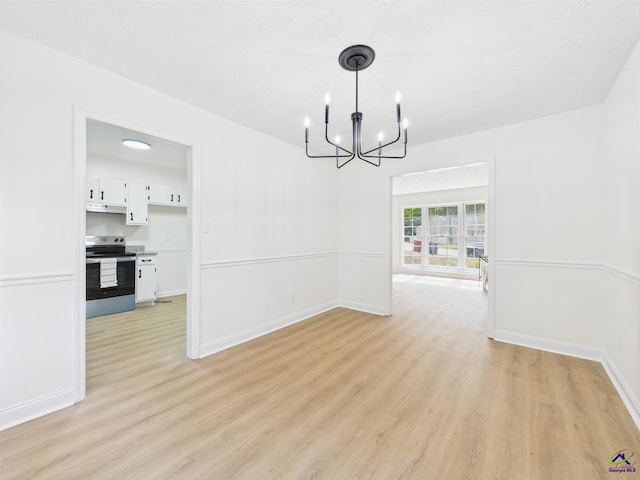 3081 Tiffin Cir, Macon, GA 31204 - unfurnished dining area featuring light wood-style flooring, a chandelier, and baseboards