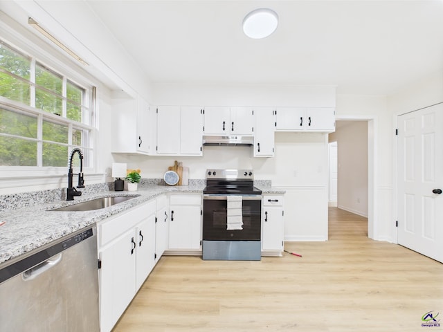 3081 Tiffin Cir, Macon, GA 31204 - kitchen featuring stainless steel appliances, a sink, light wood-style floors, light stone counters, and under cabinet range hood