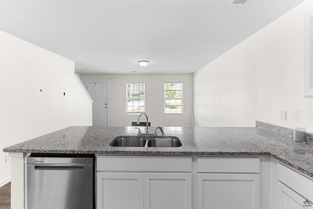 630 Ivy Brook Way, Macon, GA 31210 - kitchen featuring dishwasher, a sink, a peninsula, white cabinetry, and light stone countertops