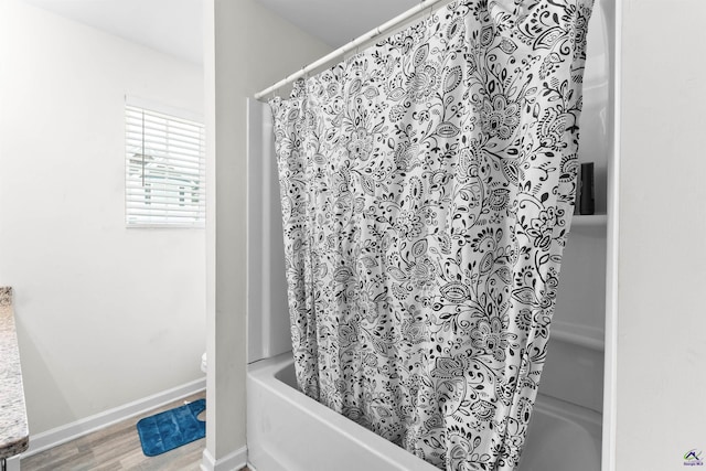 630 Ivy Brook Way, Macon, GA 31210 - bathroom featuring shower / bath combo, wood finished floors, toilet, and baseboards