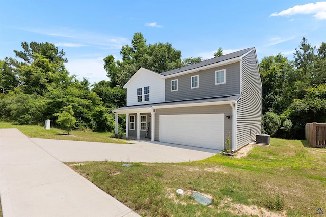 630 Ivy Brook Way, Macon, GA 31210 - traditional home with a front yard, concrete driveway, an attached garage, and central AC unit