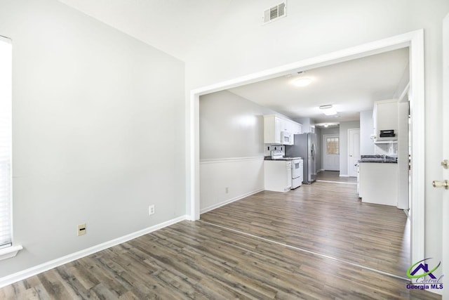 319 Smithville Church Rd, Warner Robins, GA 31088 - unfurnished living room with dark wood finished floors and baseboards