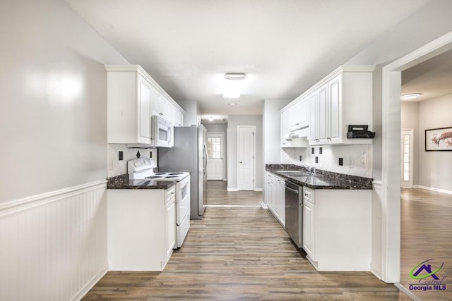 319 Smithville Church Rd, Warner Robins, GA 31088 - kitchen with white appliances, white cabinets, decorative backsplash, and a sink