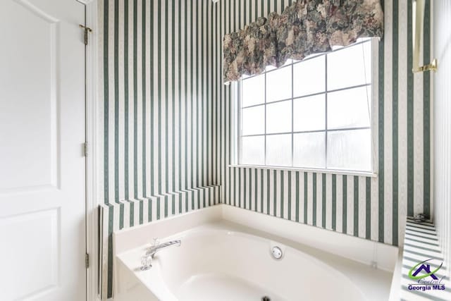319 Smithville Church Rd, Warner Robins, GA 31088 - bathroom with wallpapered walls, a garden tub, and plenty of natural light
