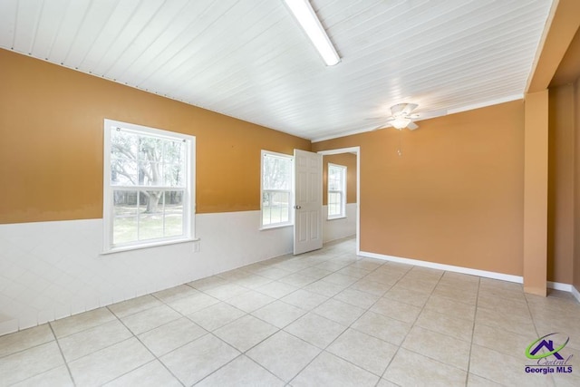 319 Smithville Church Rd, Warner Robins, GA 31088 - unfurnished room featuring a wainscoted wall, light tile patterned floors, and ceiling fan