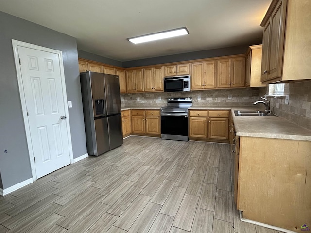 103 Lattice Bnd, Bonaire, GA 31005 - kitchen with stainless steel appliances, a sink, light wood-style floors, light countertops, and backsplash