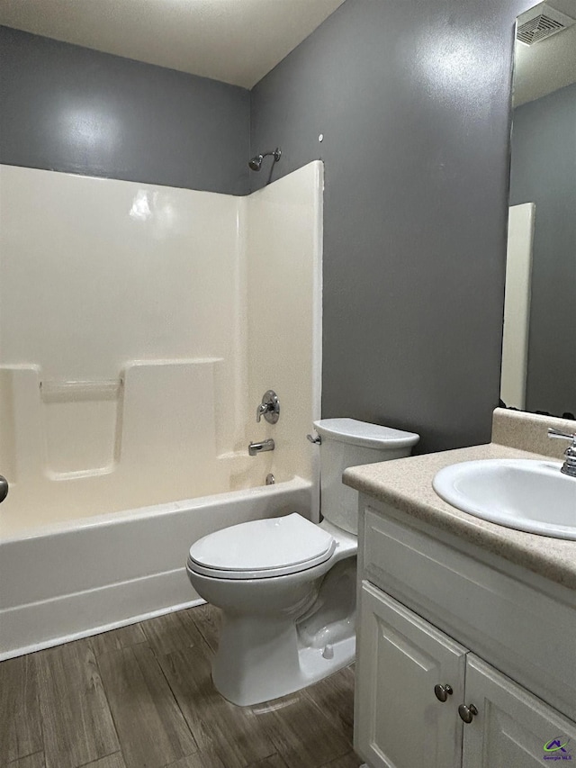 103 Lattice Bnd, Bonaire, GA 31005 - bathroom with toilet, vanity, wood finished floors, and bathtub / shower combination