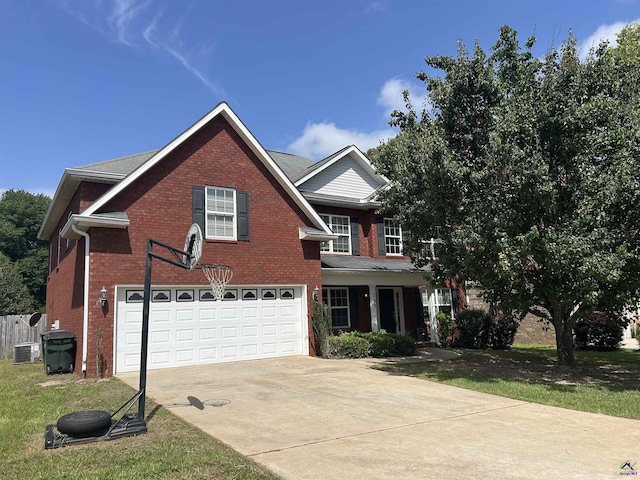 103 Lattice Bnd, Bonaire, GA 31005 - traditional home with an attached garage, concrete driveway, brick siding, and central AC unit