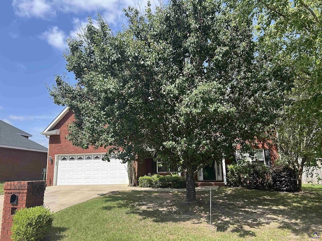 103 Lattice Bnd, Bonaire, GA 31005 - obstructed view of property featuring brick siding, driveway, and a front lawn