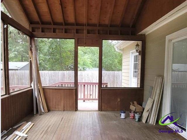 115 Friar Tuck Ave, Warner Robins, GA 31088 - unfurnished sunroom featuring vaulted ceiling and healthy amount of natural light