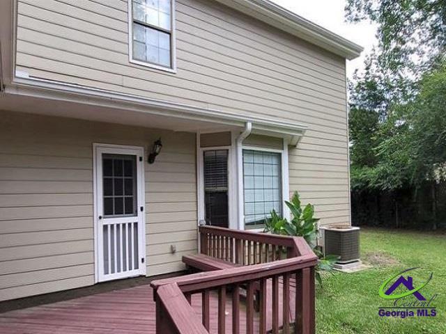 115 Friar Tuck Ave, Warner Robins, GA 31088 - wooden deck with central AC unit and a yard