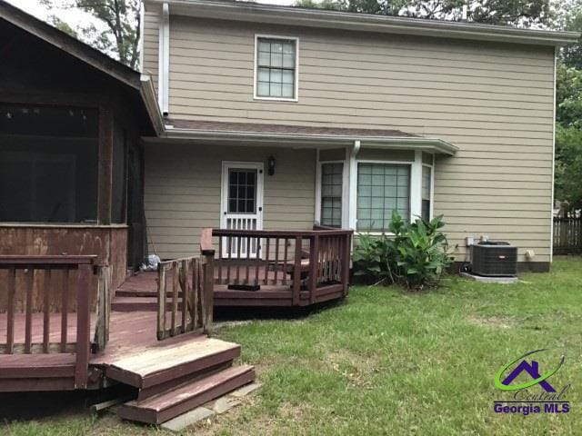 115 Friar Tuck Ave, Warner Robins, GA 31088 - rear view of house featuring a lawn, a wooden deck, and central AC