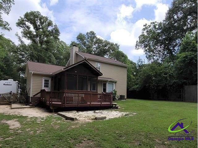 115 Friar Tuck Ave, Warner Robins, GA 31088 - back of property featuring a wooden deck and a chimney