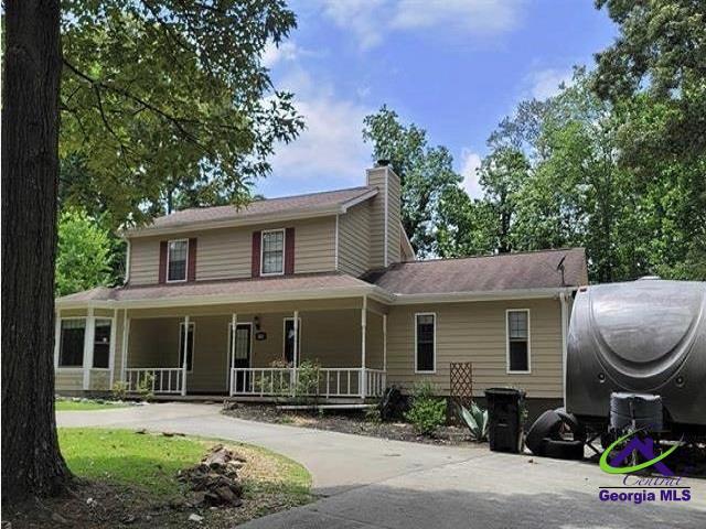 115 Friar Tuck Ave, Warner Robins, GA 31088 - farmhouse inspired home featuring covered porch and a chimney