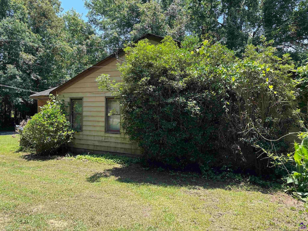 4723 Massey Rd, Macon, GA 31206 - view of side of home featuring a lawn