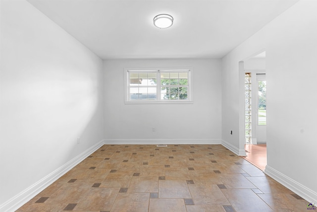 202 Kimberly Rd, Warner Robins, GA 31093 - spare room with baseboards and light stone finish floors