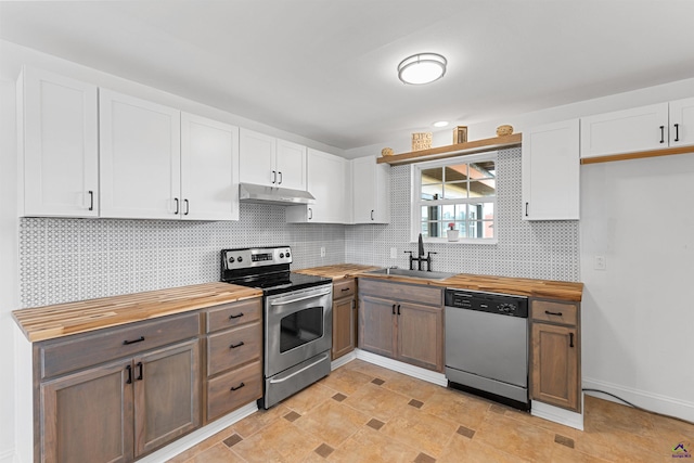 202 Kimberly Rd, Warner Robins, GA 31093 - kitchen featuring appliances with stainless steel finishes, butcher block counters, a sink, and under cabinet range hood