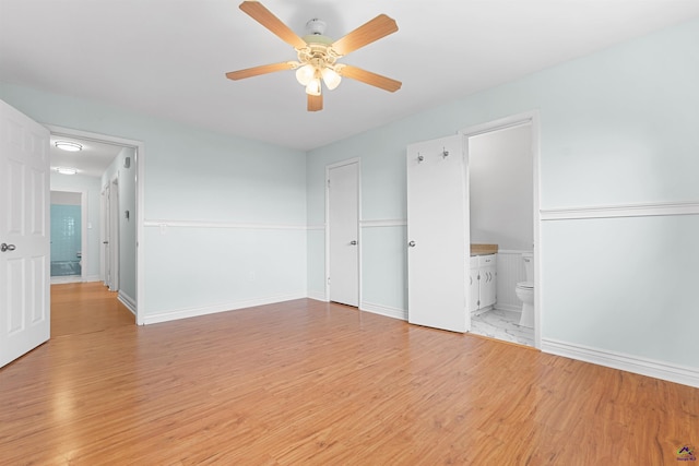 202 Kimberly Rd, Warner Robins, GA 31093 - unfurnished bedroom with light wood-style floors, ensuite bathroom, a ceiling fan, and baseboards
