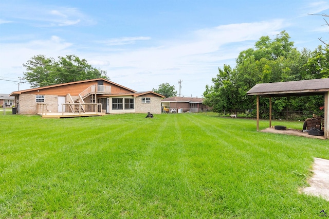 202 Kimberly Rd, Warner Robins, GA 31093 - view of grassy yard with stairway and a deck