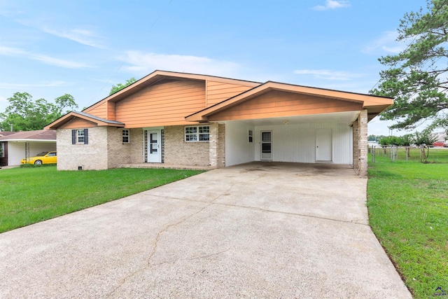 202 Kimberly Rd, Warner Robins, GA 31093 - view of front facade with driveway, brick siding, and an attached carport